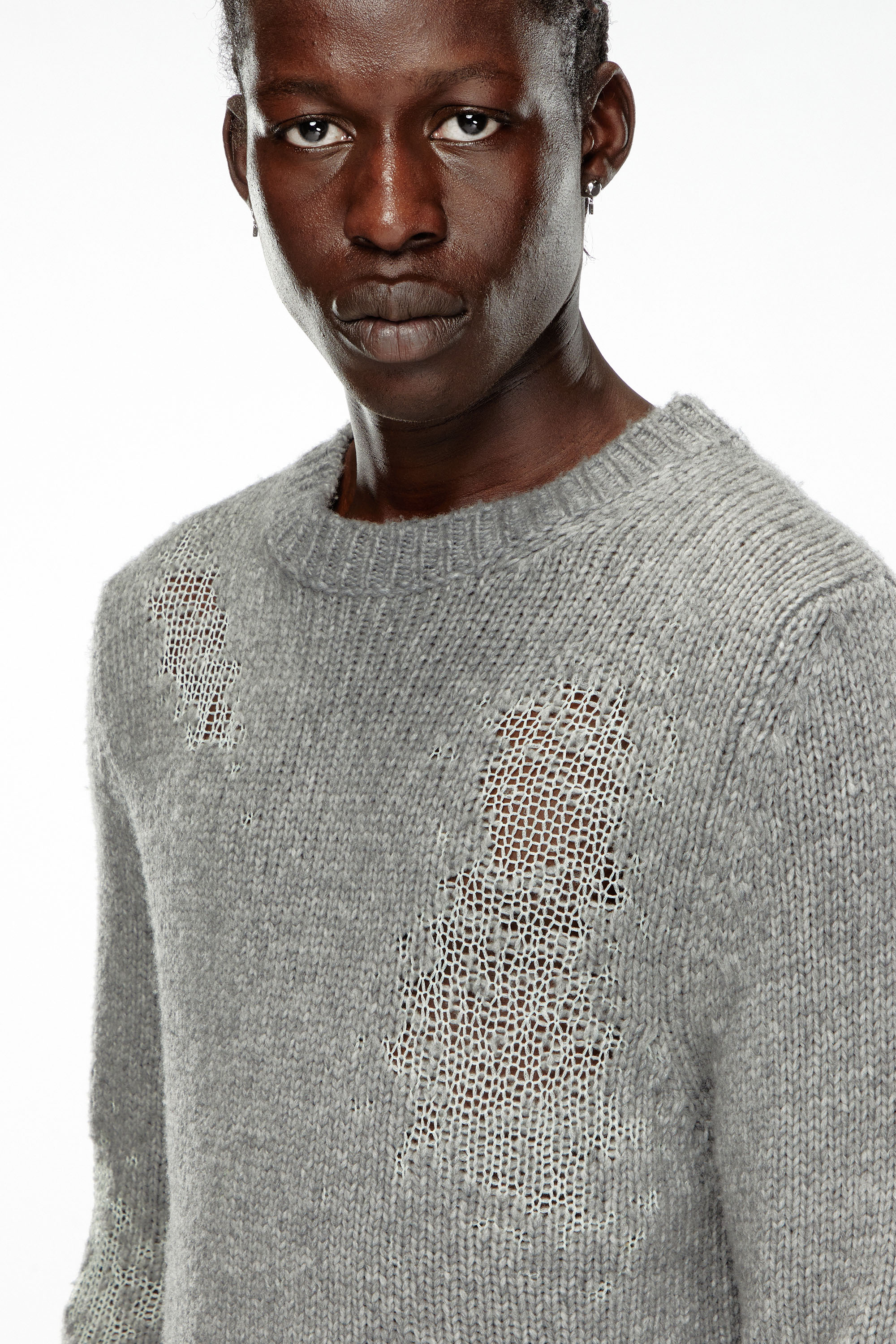 Pull cotte de maille homme sale