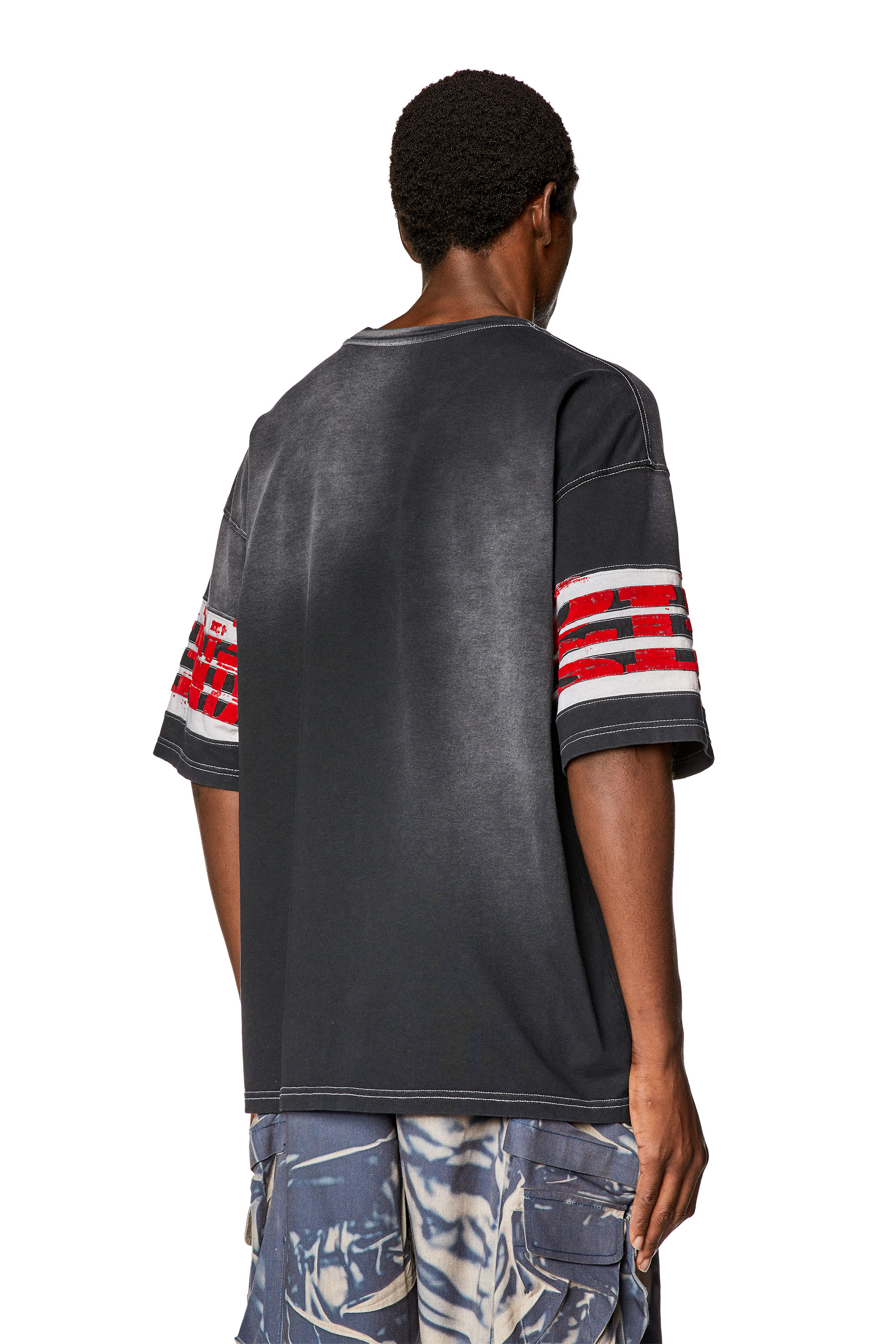 T-shirt en jersey délavé avec imprimés floqués Homme | Noir | Diesel